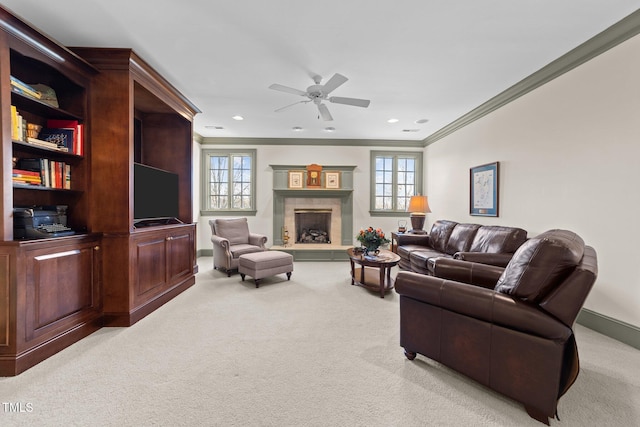 carpeted living room with ceiling fan and crown molding