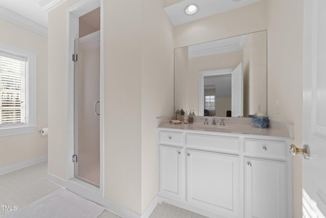 bathroom with an enclosed shower, crown molding, and vanity