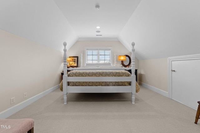 bedroom featuring lofted ceiling and light colored carpet