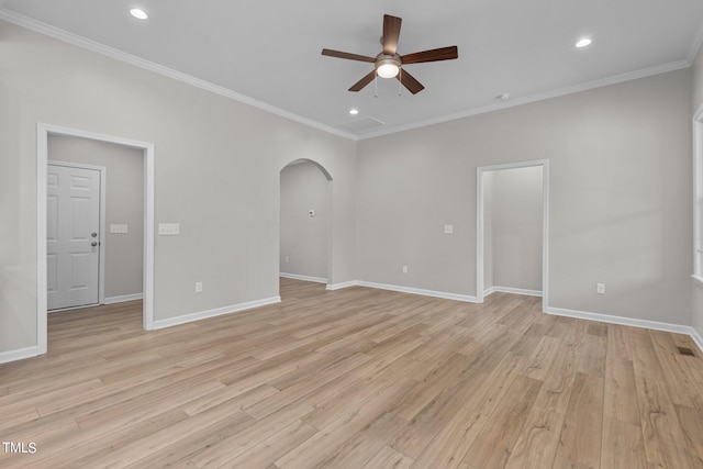 spare room featuring ceiling fan, ornamental molding, and light hardwood / wood-style flooring