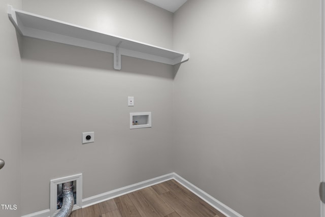 washroom featuring hookup for a washing machine, hardwood / wood-style flooring, and electric dryer hookup