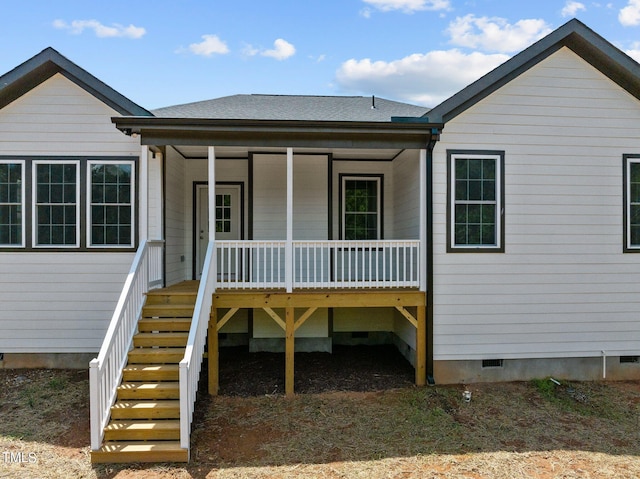 back of house featuring covered porch