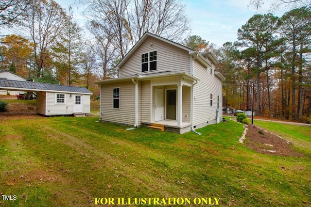 back of house featuring an outdoor structure and a lawn