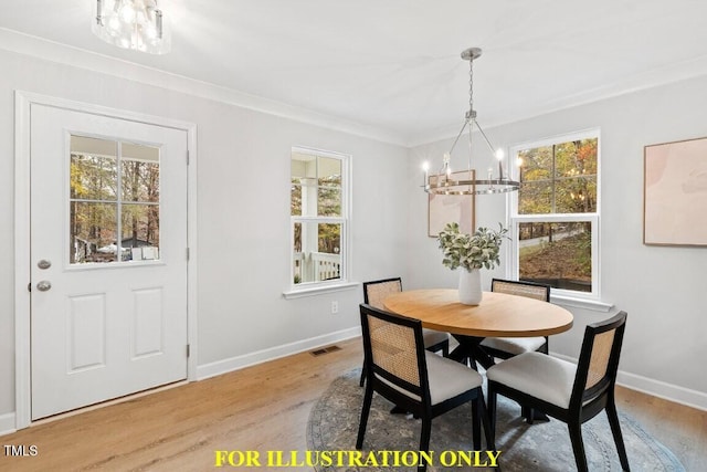 dining space with ornamental molding, a chandelier, and light wood-type flooring