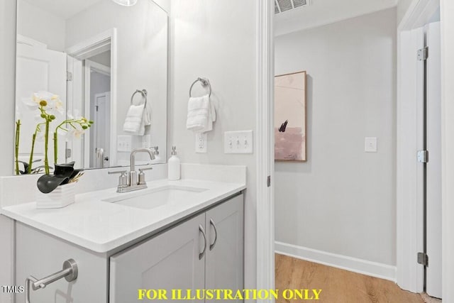 bathroom featuring hardwood / wood-style flooring and vanity