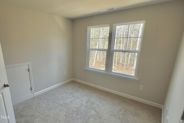 empty room with light colored carpet