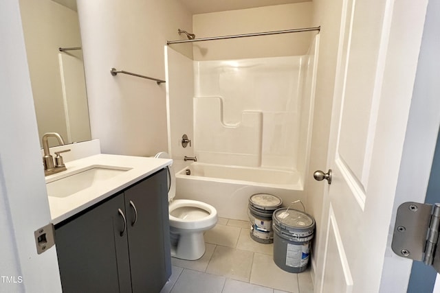 full bathroom with vanity, tile patterned floors, toilet, and washtub / shower combination