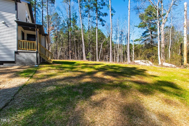 view of yard with a wooded view