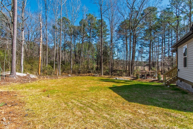 view of yard featuring a view of trees