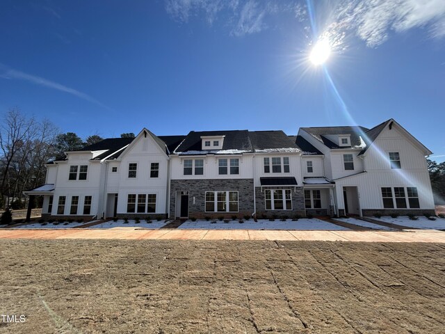 view of front of home featuring stone siding