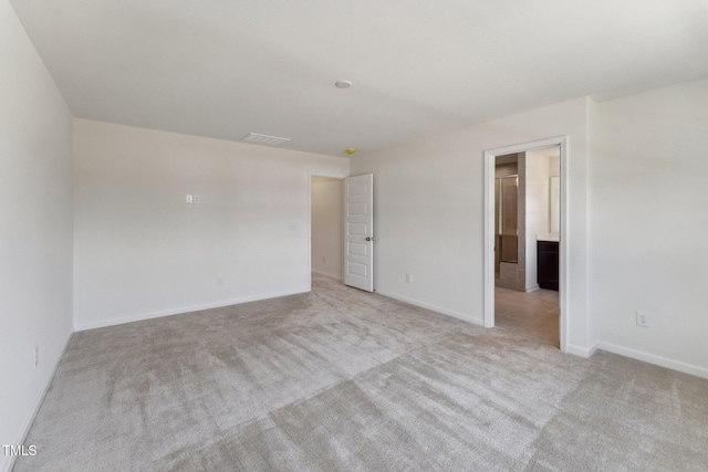 spare room with carpet flooring and baseboards