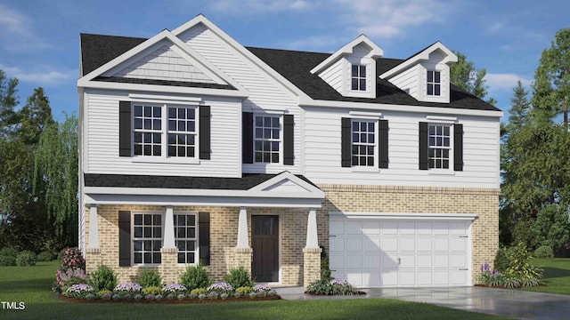 view of front of house featuring a garage and a front lawn