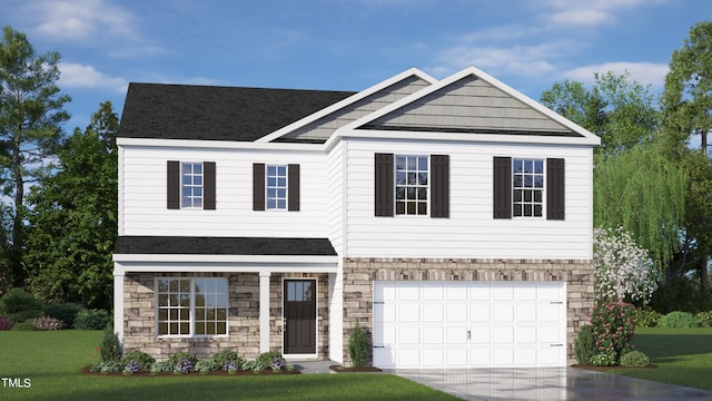 view of front of property with a front yard and a garage