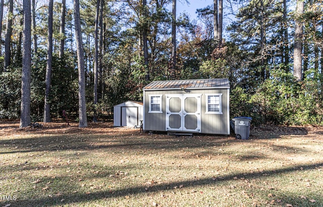 view of outbuilding with a lawn