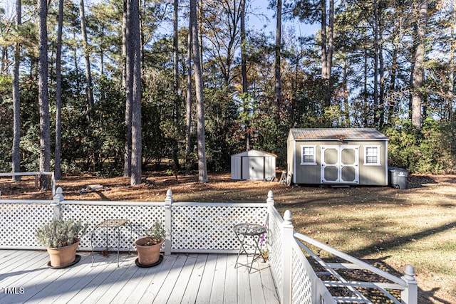 wooden deck with a yard and a shed