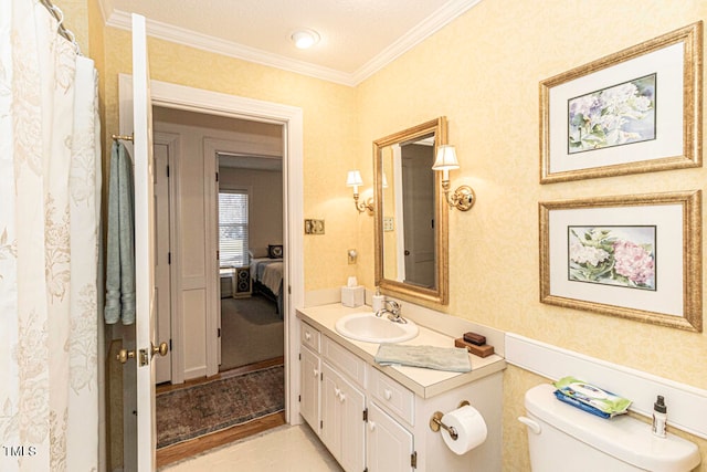 bathroom with hardwood / wood-style floors, vanity, toilet, and crown molding