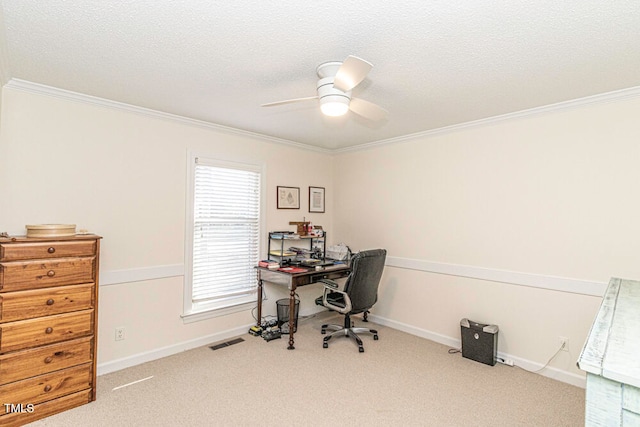 office area featuring a textured ceiling, light colored carpet, ceiling fan, and ornamental molding