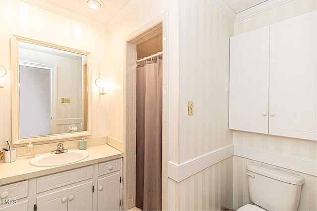 bathroom with a shower with shower curtain, vanity, toilet, and crown molding