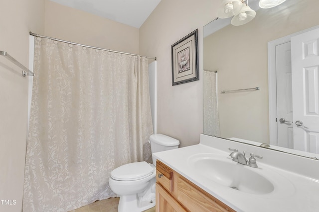 bathroom with tile patterned floors, vanity, and toilet