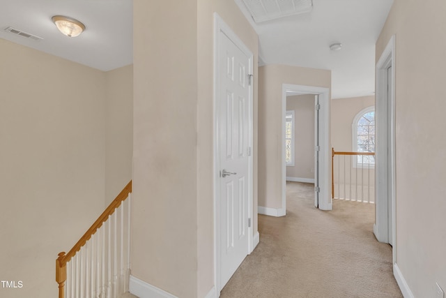 hallway with light carpet