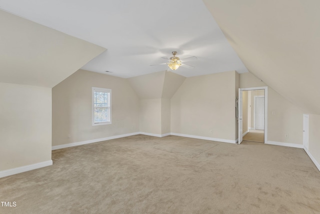 bonus room with carpet flooring, vaulted ceiling, and ceiling fan