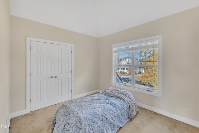 carpeted bedroom with a closet