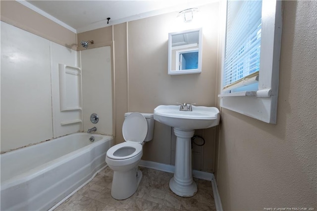 bathroom featuring toilet, shower / bathtub combination, and ornamental molding