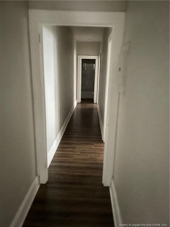 hallway featuring dark hardwood / wood-style floors