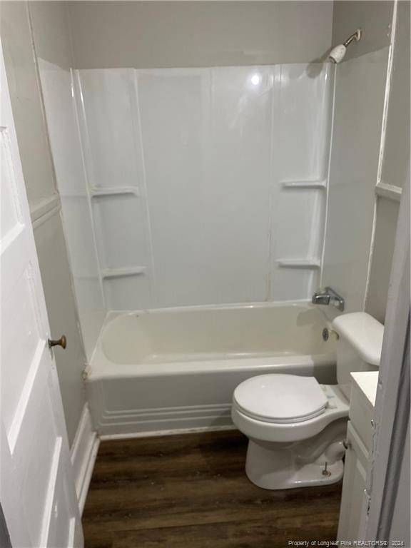 full bathroom featuring vanity, toilet, wood-type flooring, and tub / shower combination