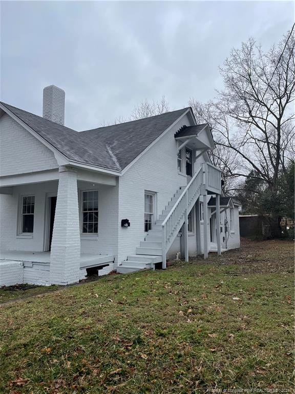 view of home's exterior featuring a lawn