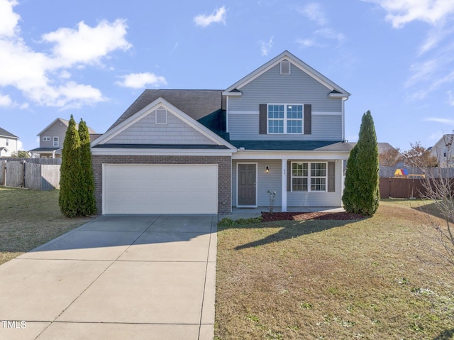 view of front of house featuring a front yard and a garage