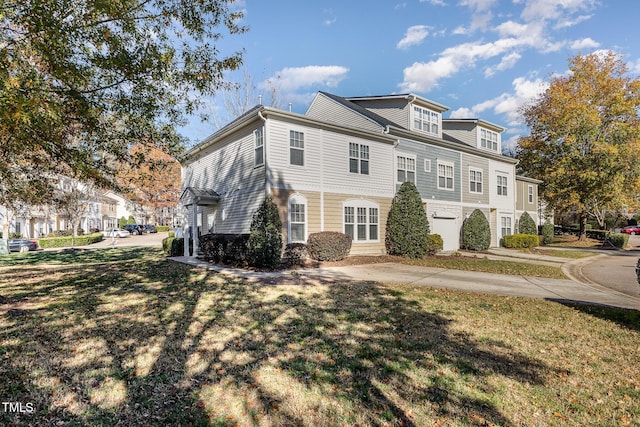 view of side of home featuring a lawn