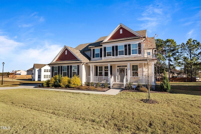 craftsman house with covered porch and a front yard