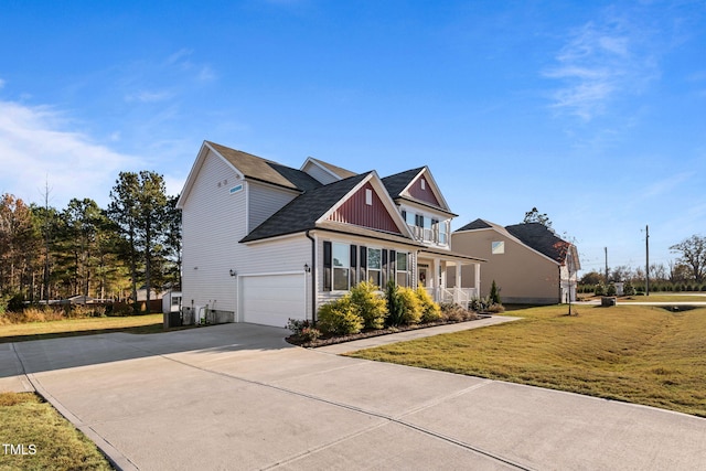 craftsman inspired home with a front yard and a garage