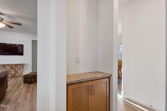 interior space with light wood-type flooring and ceiling fan