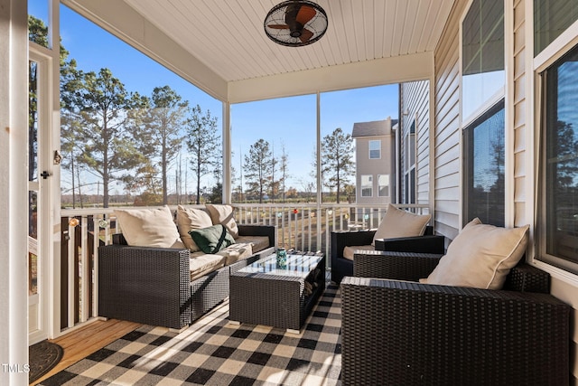 sunroom / solarium featuring wood ceiling