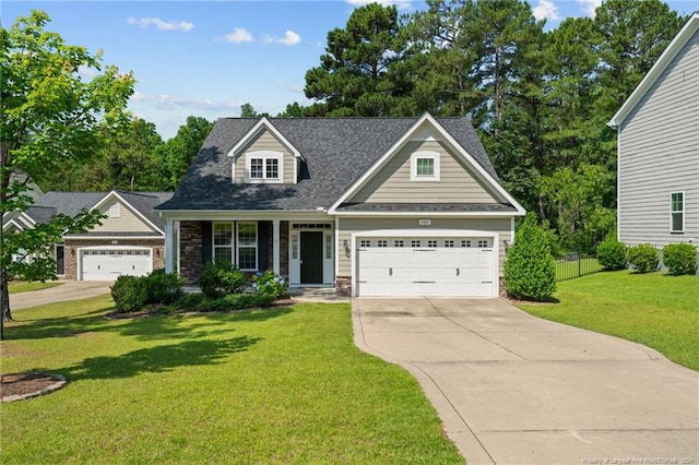 view of front of property featuring a front yard and covered porch