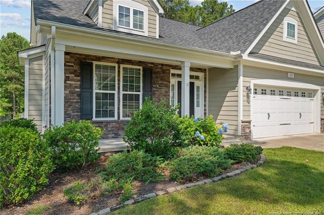 view of front of house with covered porch and a garage