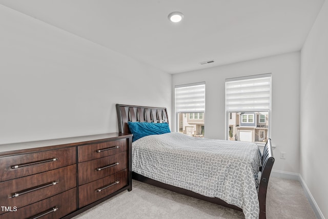 bedroom with light carpet