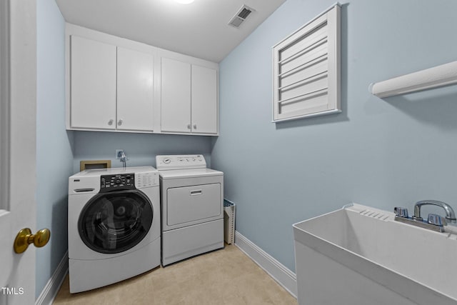 7201 Jonathan Dr, Wendell, NC 27591 - clothes washing area featuring visible vents, washing machine and clothes dryer, a sink, baseboards, and cabinet space
