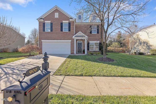 view of front of property featuring a front yard and a garage