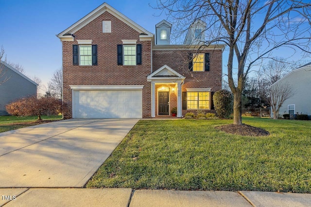 view of front of home featuring a front yard and a garage