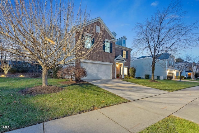 view of front of home featuring a garage and a front lawn