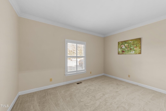 spare room featuring crown molding and light carpet