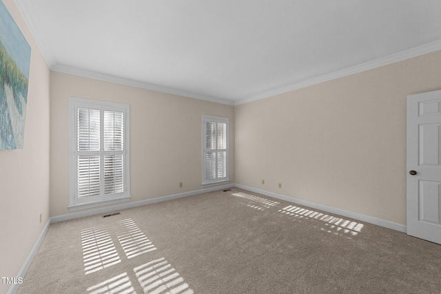 carpeted spare room with crown molding