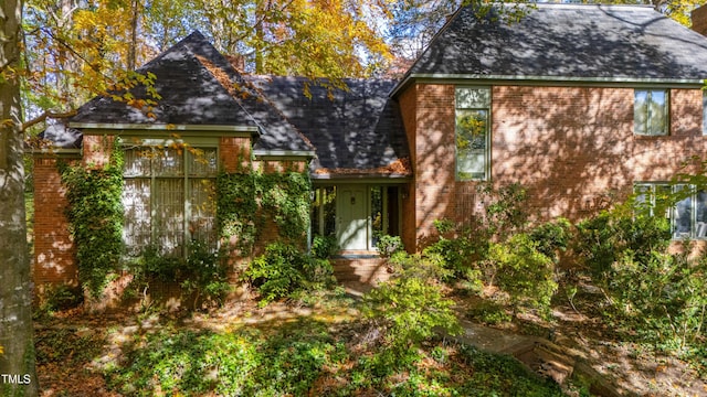 906 Marlowe Rd, Raleigh, NC 27609 - rear view of house featuring brick siding and a shingled roof