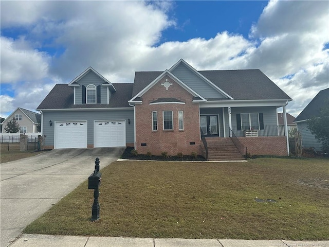 view of front facade with a garage, covered porch, and a front yard