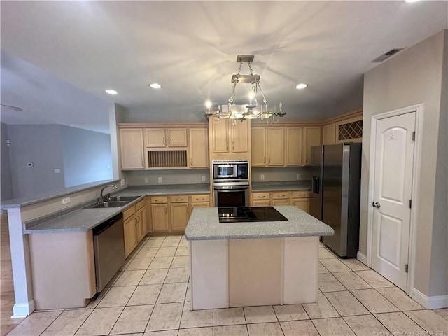 kitchen with appliances with stainless steel finishes, a center island, sink, and light brown cabinetry