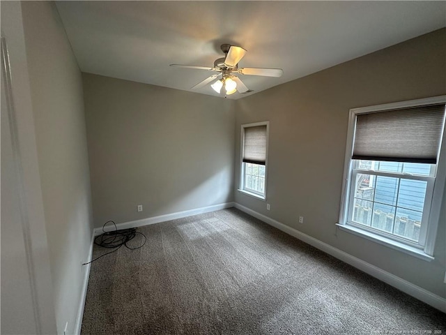 carpeted empty room with ceiling fan