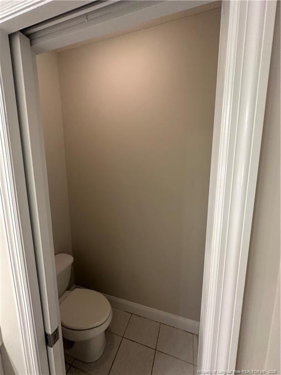 bathroom with tile patterned floors and toilet